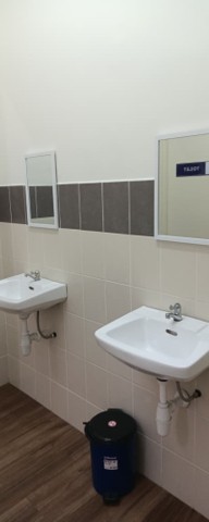 New mirrors installed above two washroom sinks